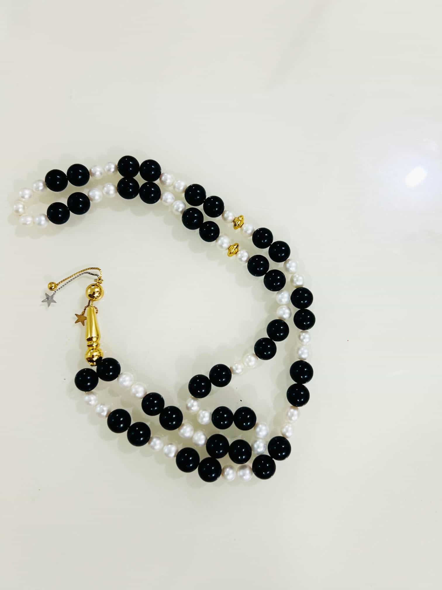مسباح ذهب عيار 18 مع لولو زراعي و احجار